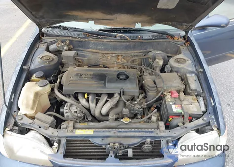 2000 Toyota Corolla Le z USA, uszkodzony, nr VIN 2T1BR12EXYC297082